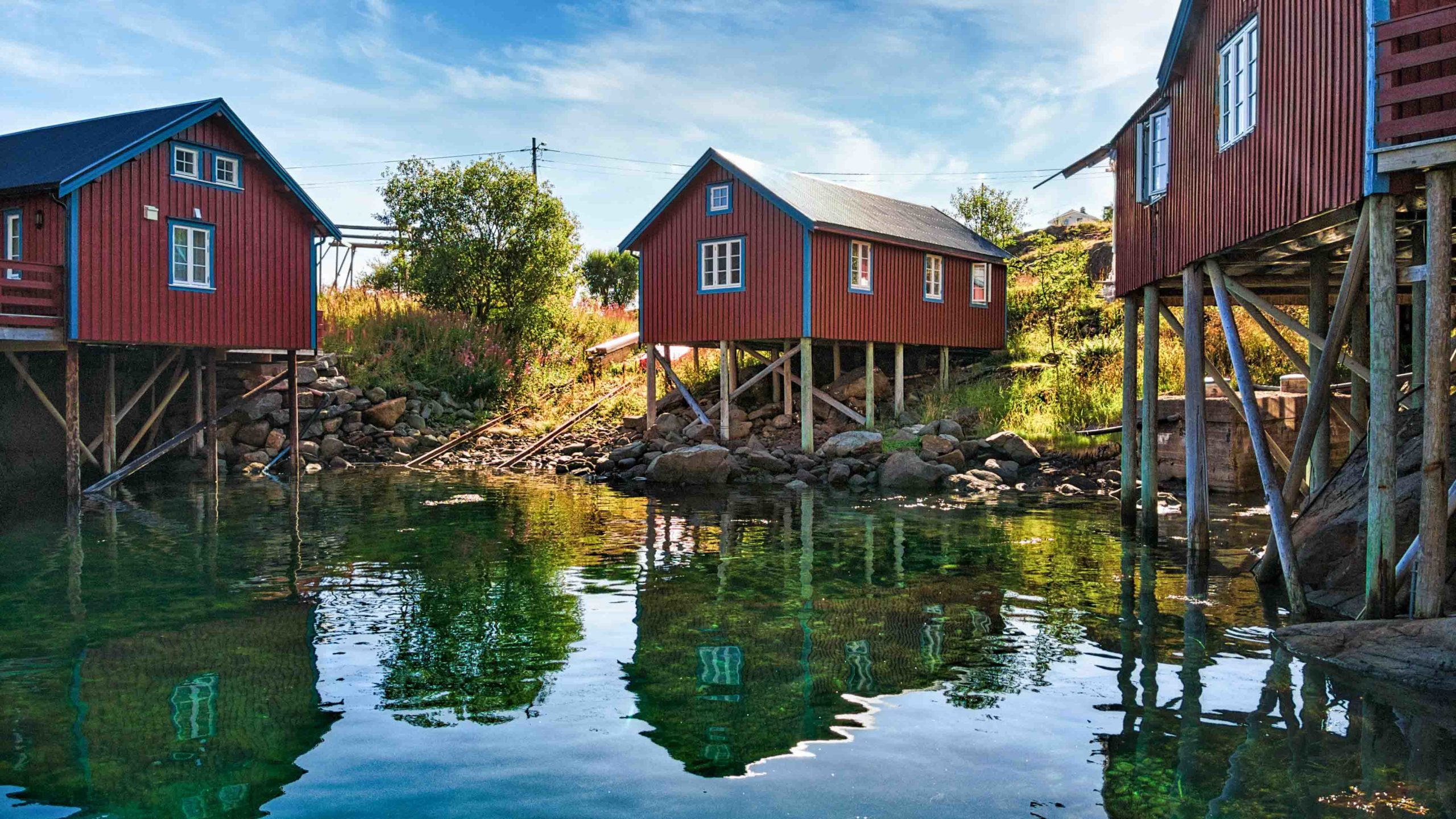 Rorbu cabins on stilts in the sea. Overview picture of Å Rorbuer..